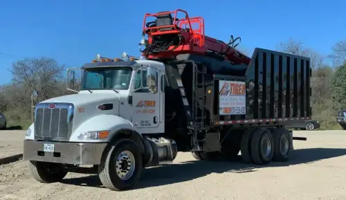 Tiger Sanitation waste management truck providing trash pickup services